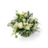 Creamy white roses, fragrant lilies, and delicate lisianthus form a serene, rounded