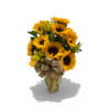 Bold, golden sunflowers with deep black centers take center stage in this