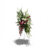 A striking asymmetric spray of red roses and white lilies rises on