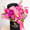 Stunning florals in pink and purple shades, arranged in a beautiful black