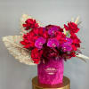 Luxurious arrangement of Roses, Peonies and Orchids in a velvet box