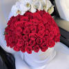 A dramatic dome of 100 velvety red roses arranged in a crisp