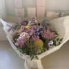 Lovely handtied bouquet, a bundle of natural seasonal stems in fresh astel