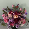An absolute stunner of a luxurious floral arrangment in deep hues of