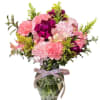 Elevate any space with our Carnations vase arrangement. This stunning bouquet features