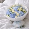 Baby blue hydrangeas with beautiful baby roses, perfect for baby showers or