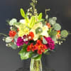 Bright, energetic color and a lively mix of textures make this flower