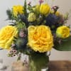 The cutest vase with bright yellow roses and tulips. The perfect pick