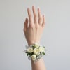 A compact wrist corsage crafted for prom nights, weddings, and elegant formal