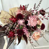 This colosal tied bouquet is a modern mixture of pinks and magentas