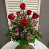 A Classic Arrangement of Red Roses and Wax Flower.
Other Color Roses are