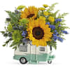 Sunflower arrangement in a mint camper-shaped container