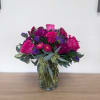 This vibrant floral arrangement features bold pinks and purples perfect for Birthdays