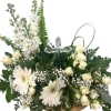 A serene white-and-green sympathy arrangement centered around a crystal cross keepsake creates