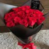 Beautiful 30 red roses wrapped in black Korean paper tied with a