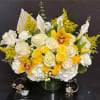 Golden Serenity Bouquet highlighting its peaceful white tones accented by rich golden