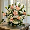 A graceful blend of white and peach flowers, the Shimmer Roses tribute