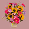 Bold yellow sunflowers and hot pink Gerbera daisies create a joyful focal