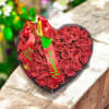 A plush heart-shaped box overflowing with glittery red silk roses makes a