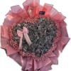 A dense heart of metallic silver roses steals the show in this