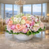A refined and romantic floral design featuring blush garden roses, soft pink