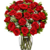 Bouquet of red roses in a clear glass vase