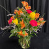 Easter arrangement with alstromeria, carnations and tulips with filler flower. 