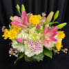 Spring floral Arrangement with Hydrangea, Lily, Daisy, Tulips and wax flower. 