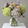 A cloud like gathering of hydrangeas in the palest washed tones. Designed