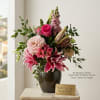 A vibrant arrangement featuring pink roses, soft dahlias, and striking stargazer lilies