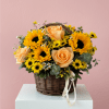 A happy mix of sunflowers, roses, and seasonal blooms in an 8&rdquo;