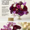A rich tapestry of burgundy calla lilies, crimson roses, fuchsia poms, and