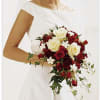 A stunning red and white wedding bouquet. It includes a mix of