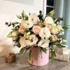 This elegant arrangement in a pink box features a delicate combination of