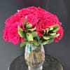 A bold dome of hot pink roses makes an immediate impression -
