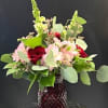 Velvety red roses clustered with soft pink alstroemeria create an instantly romantic