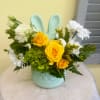 Yellow spray roses, green hydrangeas and white daisies in a blue rabbit