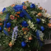A graceful expression of remembrance, features a soothing blend of deep navy
