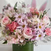 Soft pastel pinks and lavender mingle with crisp white blooms in a