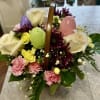 CUTE EASTER BASKET OF PLASTIC EGGS, ROSES, MUMS, CARNATIONS AND BABY'S BREATH
