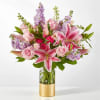 Timeless and glam, this gift of pink roses, lavender stock and starfighter