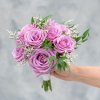 Eight roses with just a hint of greenery. You choose the color