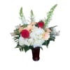 A timeless expression of love and elegance, this arrangement features rich red