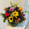 Bright sunflower and lily arrangement with roses, carnations and seasonal flowers, hand-designed