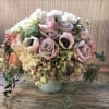 Perfect palette of nude and blushing fresh flowers arranged in a classic