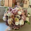 Very elegant, classic and warm. This arrangement is a centerpiece style floral
