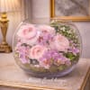 A refined and luxurious floral design featuring soft blush ranunculus and delicate
