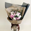 Light pink and white roses with accents of wax flowers - fashioned