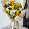 A radiant blend of sunny yellow roses, delicate white spray roses, and