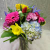 Contains Roses, Hydrangeas, Gerbera Daisy, Daffodils,. Iris, Carnations and Tropical Greenery
